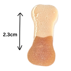 Close-up of a Good Boy bone-shaped chewy treat with a 2.3cm size guide
